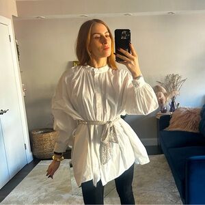 In the style Lorna Luxe mock neck chink waist high low shirt with belt